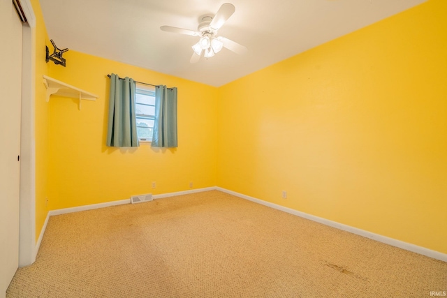 902 Hawthorne Ln, Logansport, IN 46947 - unfurnished bedroom featuring carpet flooring, a closet, baseboards, and a ceiling fan