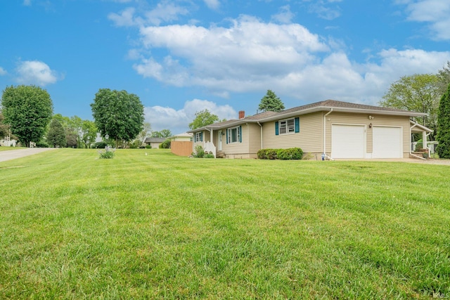 902 Hawthorne Ln, Logansport, IN 46947 - view of front of house with a garage, a front lawn, and a chimney