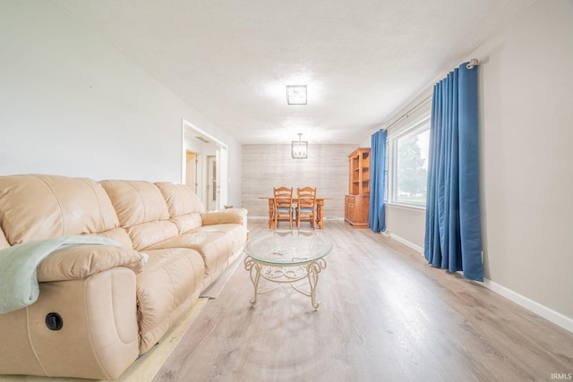902 Hawthorne Ln, Logansport, IN 46947 - living room featuring wood finished floors and baseboards