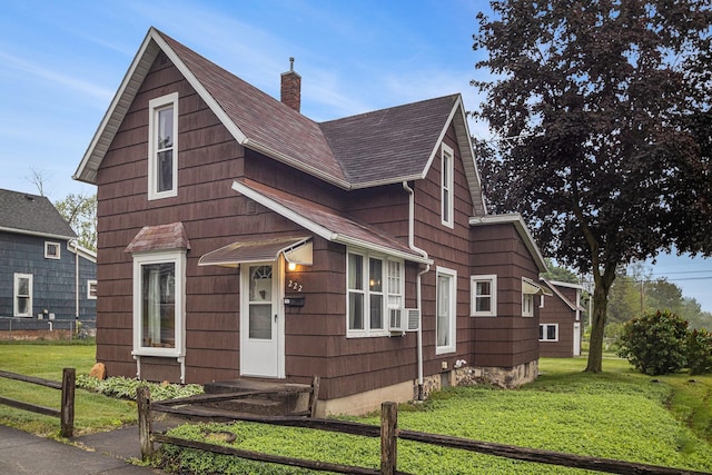 222 Queen St, Goshen, IN 46528 - view of front facade featuring a chimney, cooling unit, and roof with shingles