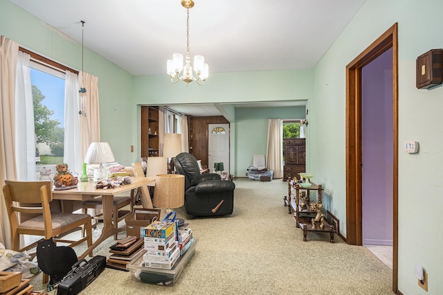 222 Queen St, Goshen, IN 46528 - dining room featuring carpet flooring and a chandelier