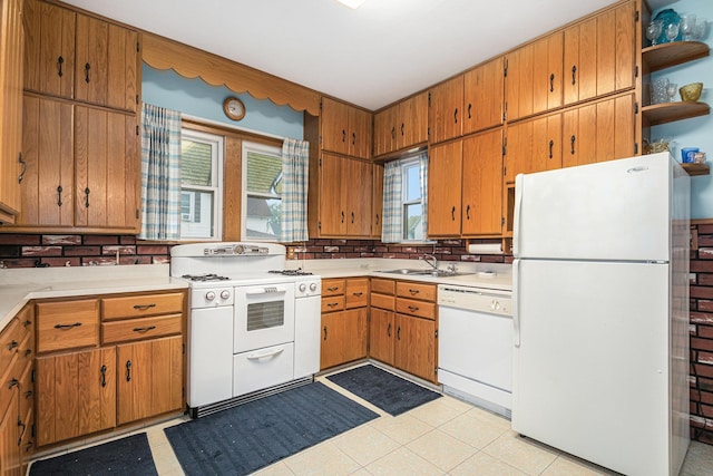 222 Queen St, Goshen, IN 46528 - kitchen with white appliances, a sink, light countertops, brown cabinets, and open shelves