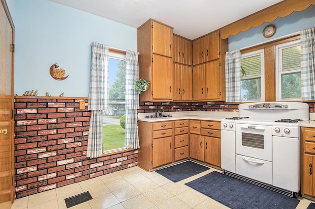 222 Queen St, Goshen, IN 46528 - kitchen featuring white gas range oven and light countertops