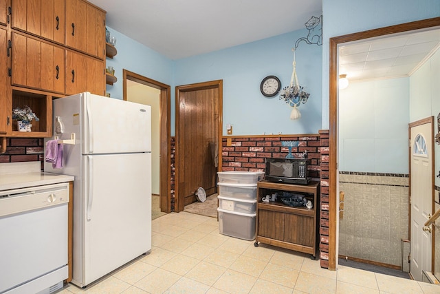 222 Queen St, Goshen, IN 46528 - kitchen with white appliances, open shelves, light countertops, a wainscoted wall, and brown cabinetry