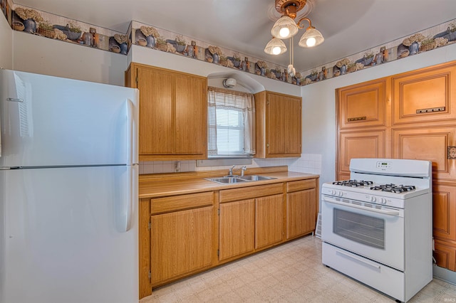 517 W Locust St, Boonville, IN 47601 - kitchen with white appliances, light flooring, light countertops, a sink, and brown cabinetry