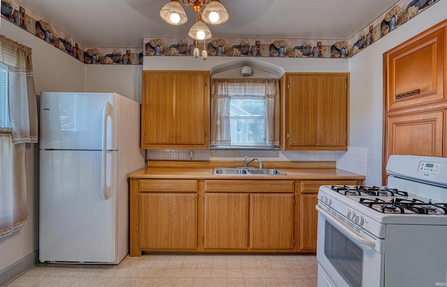 517 W Locust St, Boonville, IN 47601 - kitchen featuring white appliances, a sink, light countertops, light floors, and brown cabinetry