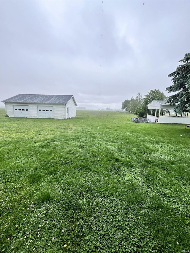 12537 E 340 S, Greentown, IN 46936 - view of green lawn with a detached garage and an outdoor structure
