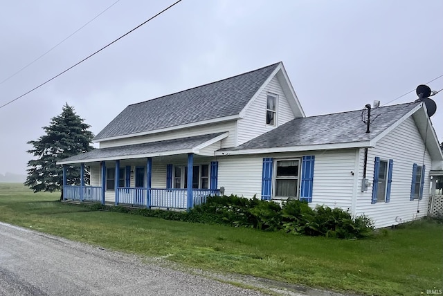 12537 E 340 S, Greentown, IN 46936 - view of front of property featuring covered porch, a shingled roof, and a front lawn