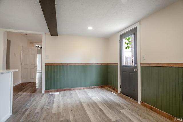 355 Blinn Ave, Frankfort, IN 46041 - entryway with a wainscoted wall, wood finished floors, and a textured ceiling