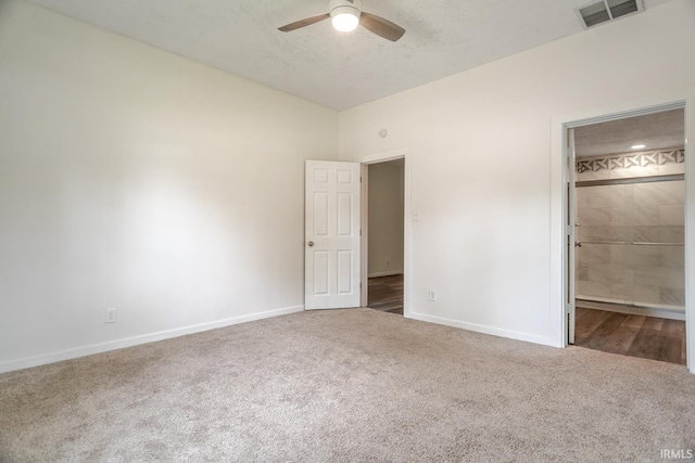 355 Blinn Ave, Frankfort, IN 46041 - unfurnished bedroom featuring vaulted ceiling, carpet flooring, baseboards, a textured ceiling, and ceiling fan