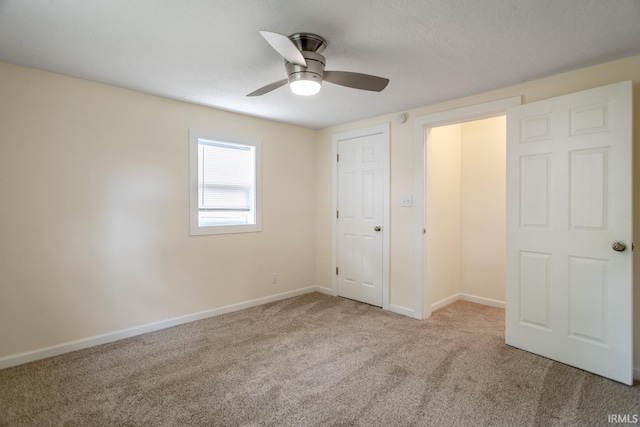 355 Blinn Ave, Frankfort, IN 46041 - unfurnished bedroom featuring carpet, baseboards, and a ceiling fan