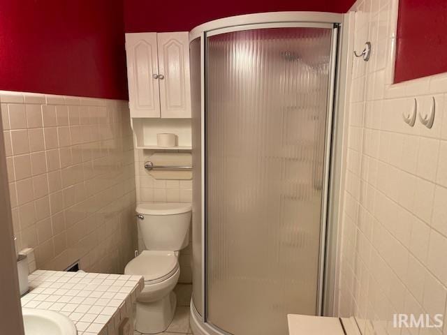 2725 Marion Ave, Evansville, IN 47712 - full bath with tile walls, a stall shower, vanity, tile patterned flooring, and toilet