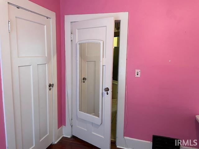 2725 Marion Ave, Evansville, IN 47712 - corridor with baseboards and dark wood-type flooring