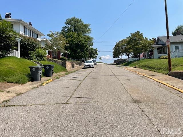 2725 Marion Ave, Evansville, IN 47712 - view of asphalt street with sidewalks, a residential view, and curbs