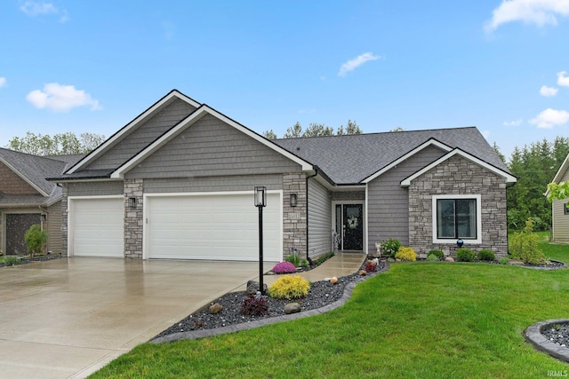 15332 Annabelle Pl, Leo, IN 46765 - craftsman house featuring stone siding, a garage, driveway, and a front yard