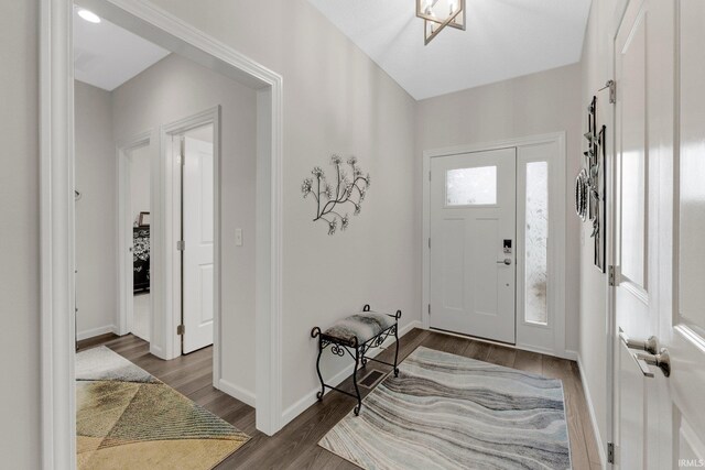 15332 Annabelle Pl, Leo, IN 46765 - foyer entrance with dark wood-style flooring and baseboards