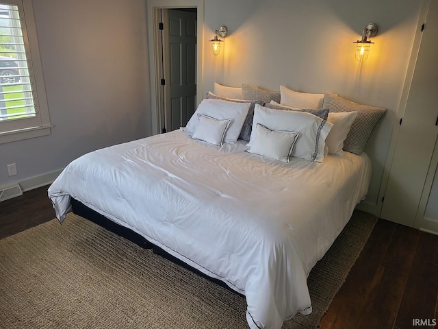 6167 E Pickwick Park Dr, Syracuse, IN 46567 - bedroom with wood finished floors and baseboards