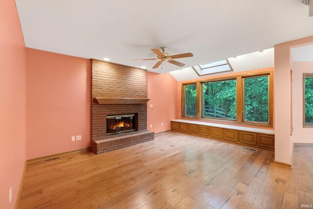 2711 Spring Creek Dr, Fort Wayne, IN 46808 - unfurnished living room with ceiling fan, light wood finished floors, a brick fireplace, baseboards, and recessed lighting