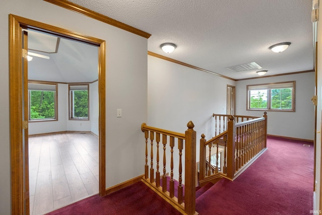2711 Spring Creek Dr, Fort Wayne, IN 46808 - hall featuring an upstairs landing, baseboards, a textured ceiling, crown molding, and wood finished floors