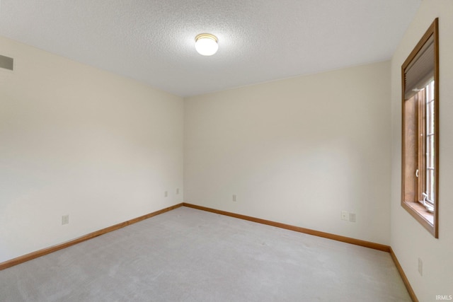 2711 Spring Creek Dr, Fort Wayne, IN 46808 - spare room with light carpet, baseboards, and a textured ceiling