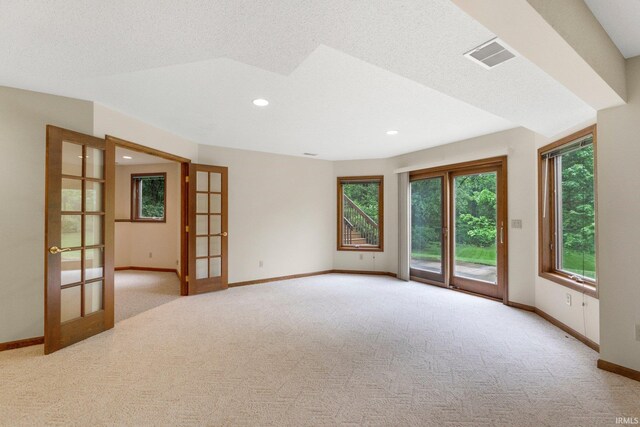 2711 Spring Creek Dr, Fort Wayne, IN 46808 - spare room featuring french doors, baseboards, carpet flooring, and recessed lighting