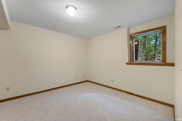 2711 Spring Creek Dr, Fort Wayne, IN 46808 - empty room with light colored carpet, a textured ceiling, and baseboards