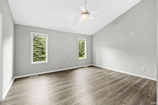 1224 Foxglove Ct, Mishawaka, IN 46545 - empty room with healthy amount of natural light, wood finished floors, a ceiling fan, and lofted ceiling