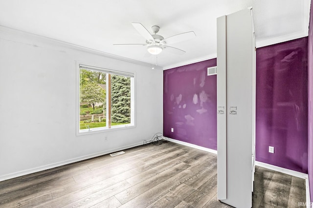 1224 Foxglove Ct, Mishawaka, IN 46545 - empty room with ceiling fan, wood finished floors, ornamental molding, and baseboards