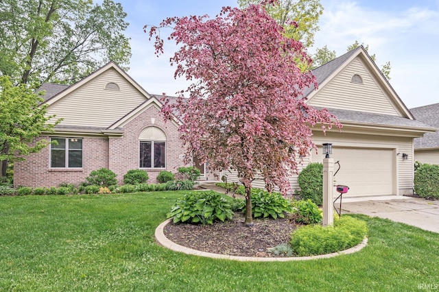 1224 Foxglove Ct, Mishawaka, IN 46545 - single story home featuring a garage, concrete driveway, a shingled roof, a front yard, and brick siding