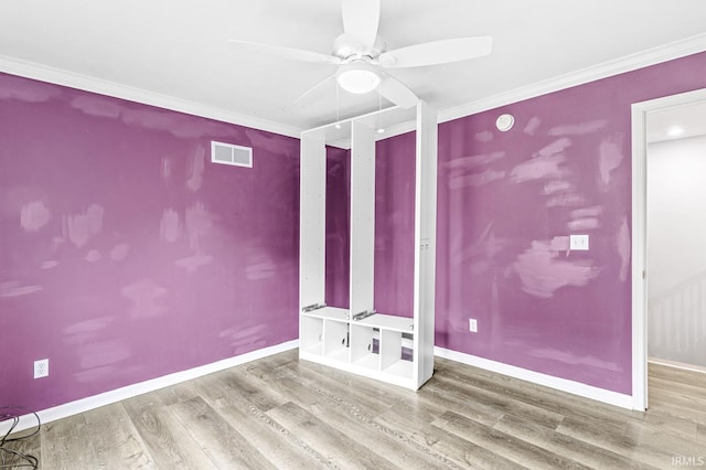1224 Foxglove Ct, Mishawaka, IN 46545 - spare room with wood finished floors, ceiling fan, baseboards, and crown molding