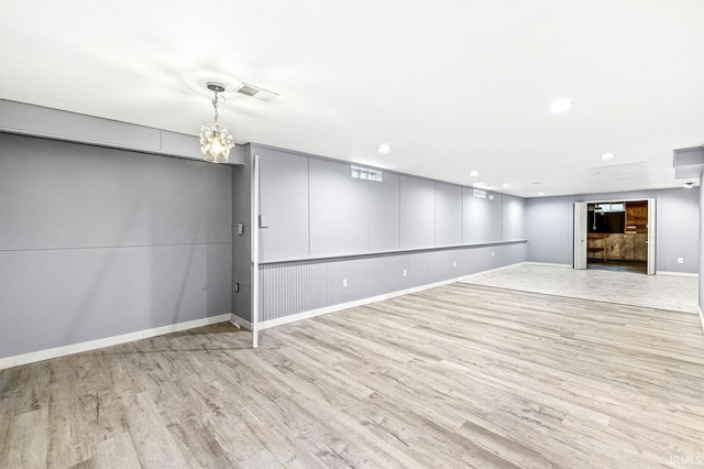 1224 Foxglove Ct, Mishawaka, IN 46545 - finished basement with wood finished floors, baseboards, recessed lighting, and a chandelier