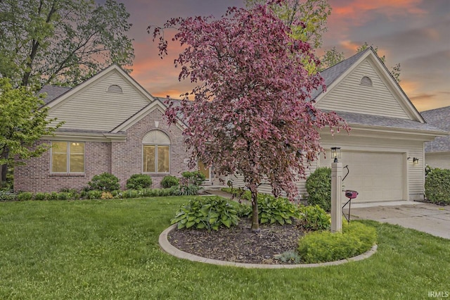 1224 Foxglove Ct, Mishawaka, IN 46545 - single story home with an attached garage, driveway, roof with shingles, a front yard, and brick siding