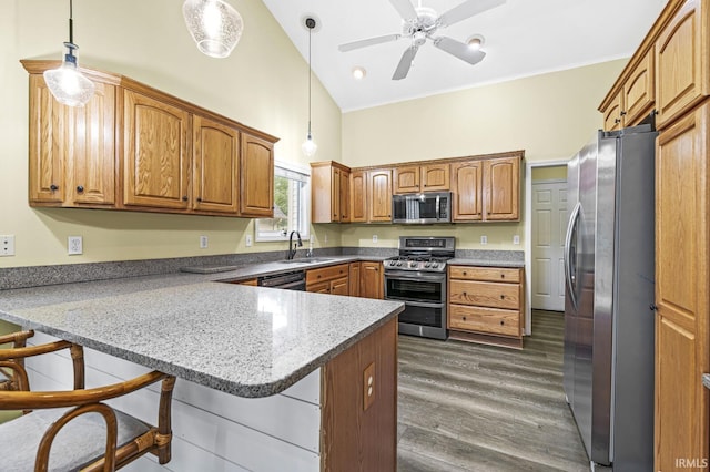 1224 Foxglove Ct, Mishawaka, IN 46545 - kitchen featuring appliances with stainless steel finishes, a peninsula, a sink, high vaulted ceiling, and a kitchen bar