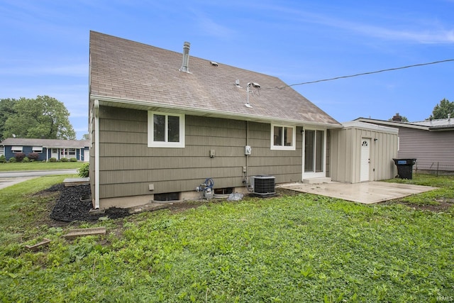 4113 York Rd, South Bend, IN 46614 - rear view of house with a patio area, a lawn, and roof with shingles