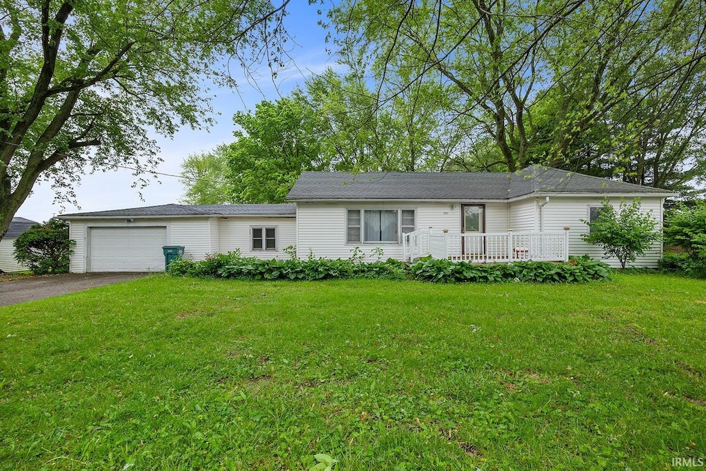 3907 E 150 S, Crawfordsville, IN 47933 - ranch-style house featuring driveway, an attached garage, and a front lawn