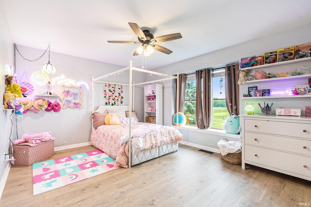 65600 Ash Rd, Wakarusa, IN 46573 - bedroom featuring baseboards, light wood-type flooring, and a ceiling fan