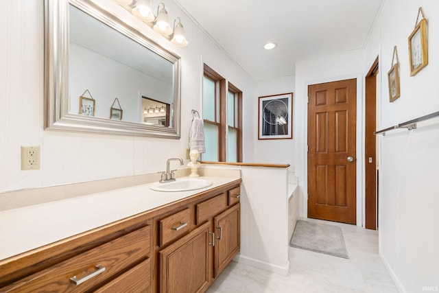65600 Ash Rd, Wakarusa, IN 46573 - full bath featuring vanity, a bath, and baseboards