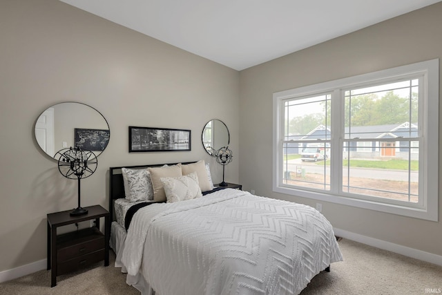 51650 Prescott Ave, South Bend, IN 46637 - bedroom with baseboards, light colored carpet, and multiple windows