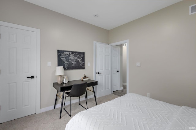 51650 Prescott Ave, South Bend, IN 46637 - bedroom featuring light colored carpet, an office area, and baseboards