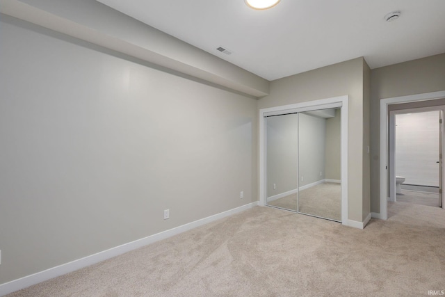 51650 Prescott Ave, South Bend, IN 46637 - unfurnished bedroom featuring light colored carpet, a closet, and baseboards