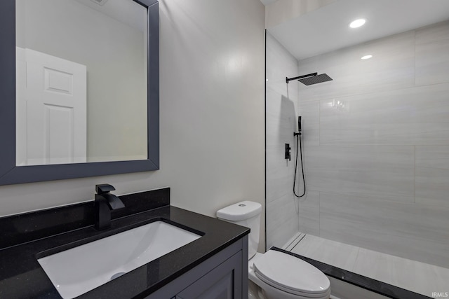 51650 Prescott Ave, South Bend, IN 46637 - full bathroom featuring toilet, a tile shower, and vanity