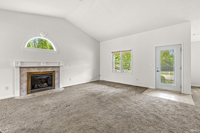 4019 Riverside Dr, South Bend, IN 46628 - unfurnished living room with plenty of natural light, lofted ceiling, carpet, a fireplace, and baseboards