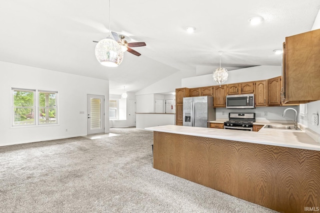 4019 Riverside Dr, South Bend, IN 46628 - kitchen with stainless steel appliances, a sink, lofted ceiling, a ceiling fan, and light carpet