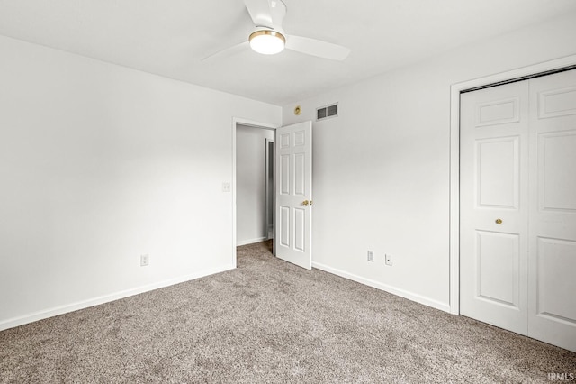 4019 Riverside Dr, South Bend, IN 46628 - unfurnished bedroom featuring carpet floors, baseboards, a closet, and a ceiling fan