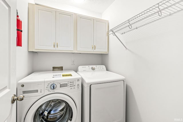 4019 Riverside Dr, South Bend, IN 46628 - washroom with cabinet space and washing machine and clothes dryer