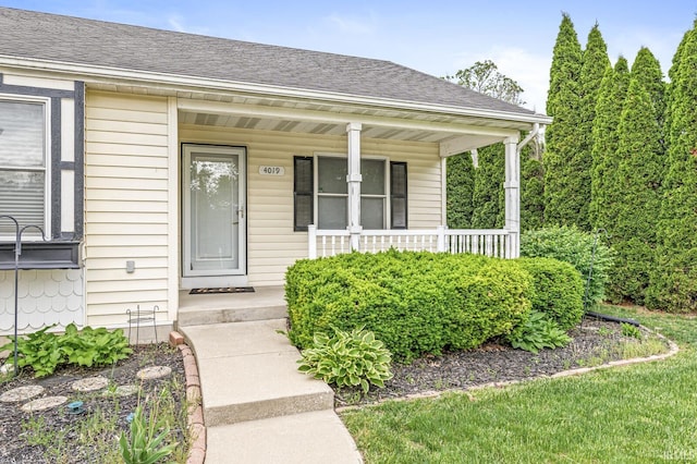 4019 Riverside Dr, South Bend, IN 46628 - view of exterior entry with covered porch and roof with shingles