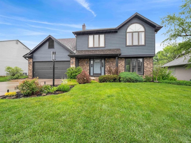 9826 Flag Stone Pl, Fort Wayne, IN 46804 - traditional-style house featuring brick siding, a chimney, a front yard, and an attached garage