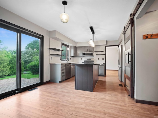 9826 Flag Stone Pl, Fort Wayne, IN 46804 - kitchen featuring open shelves, stainless steel appliances, gray cabinetry, and light wood-type flooring