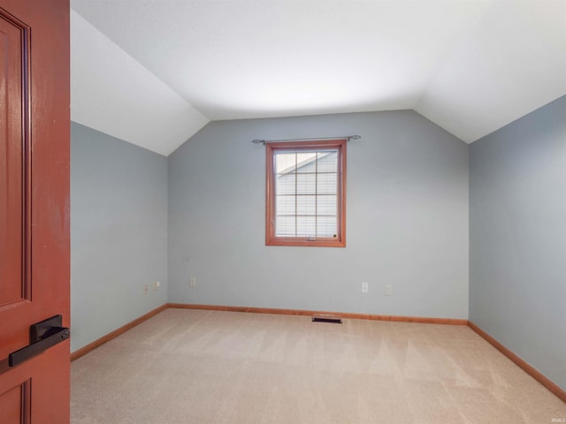 9826 Flag Stone Pl, Fort Wayne, IN 46804 - bonus room featuring vaulted ceiling, light carpet, and baseboards