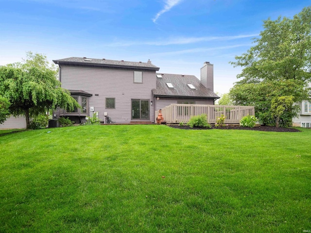 9826 Flag Stone Pl, Fort Wayne, IN 46804 - rear view of property with a wooden deck, a yard, and a chimney